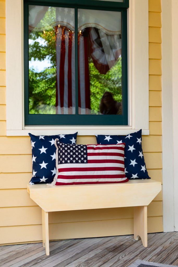 Sunny bench with stars and stripes pillows