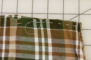 Stitching a gathering stitch. Easy to whip up easy sew fabric pumpkins. Stitching a gathering stitch