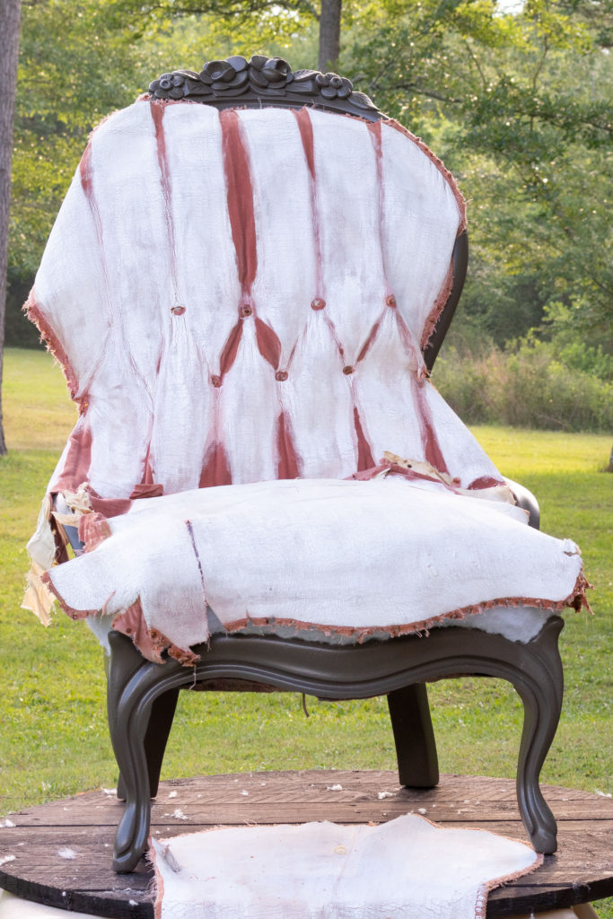 The original fabric placed over the painted chair