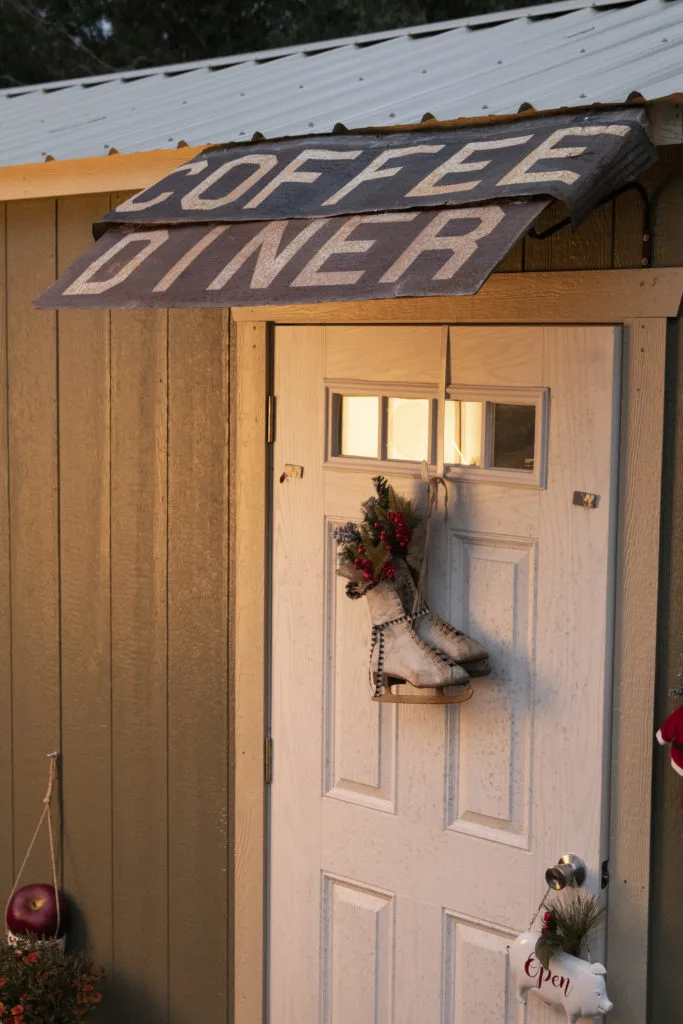 Clever awning Clever awning made from 2 signs (coffee and diner) over the she shed door