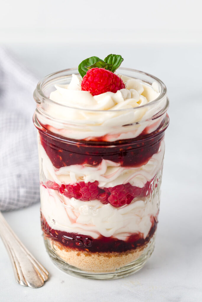 Garnish the top with raspberries and mint