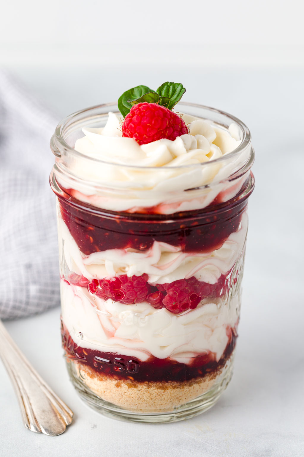 Garnish the top with raspberries and mint