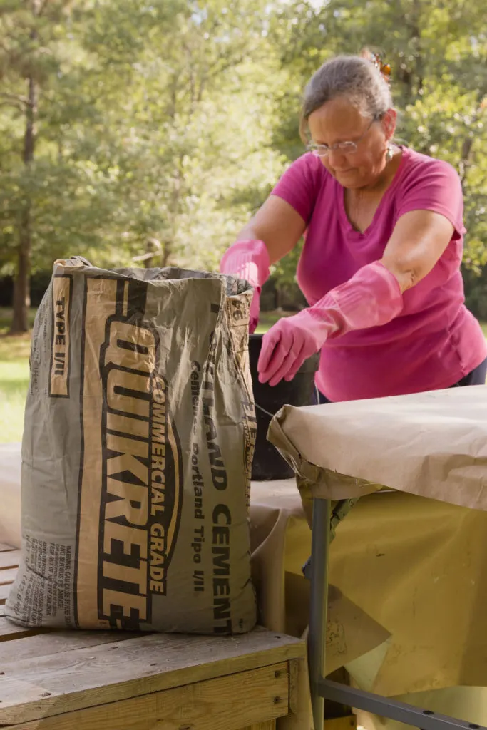 female mixing cement Kippi's first time mixing concrete