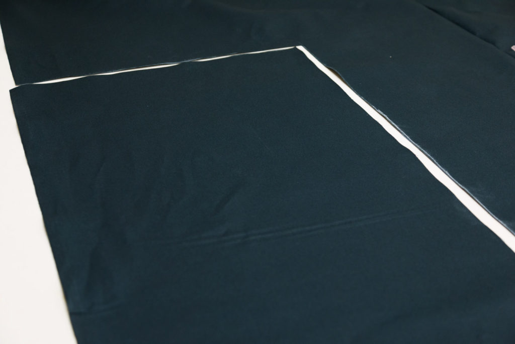 The tote is cut out and ready to pin on the handles and serge. my tote bag canvas is ready to serge