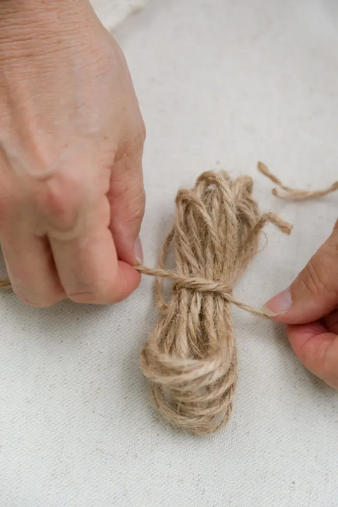 Tying the rustic twine bow loops