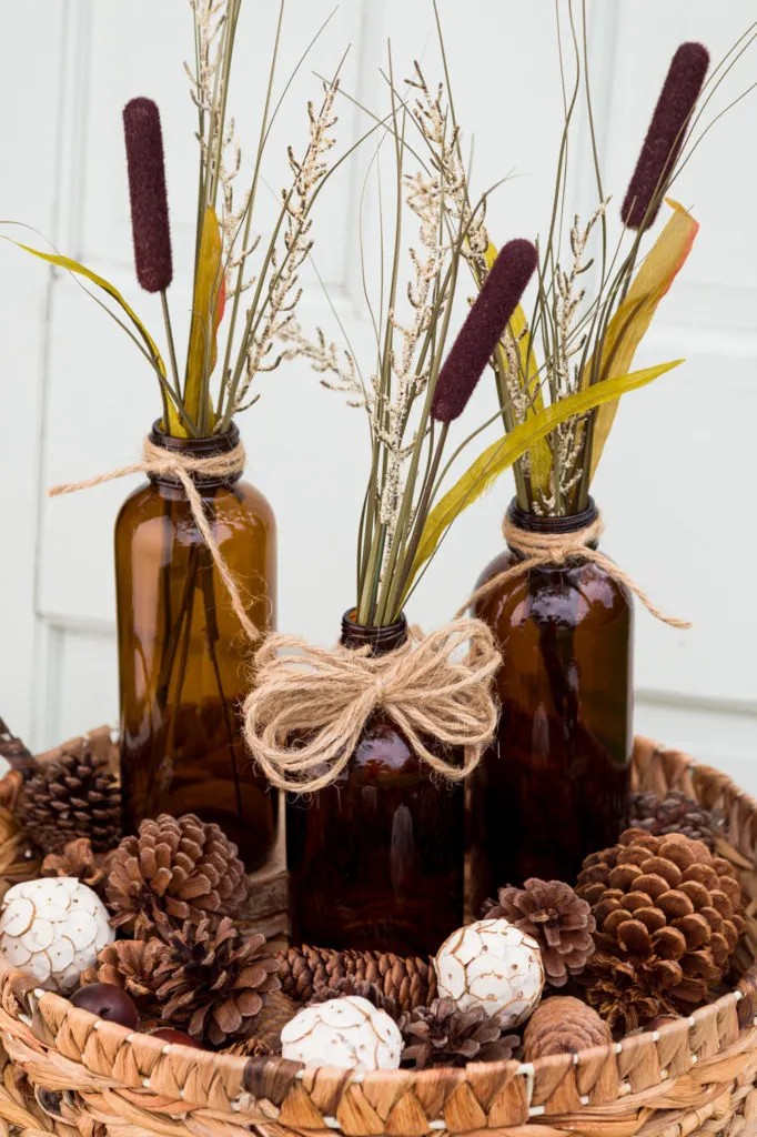 Wicker tray with bottles and cattails 