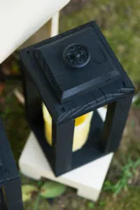 Lanterns topped with Vintage cabinet knobs spray painted black