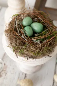 DIY Spring Decor bird nest on pedestal