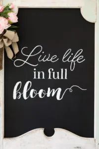 Vintage door upcycled into a Farmhouse Spring Chalkboard Sign 
