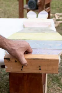 Screwing the stand block to the bottom of the pallet wood bunny