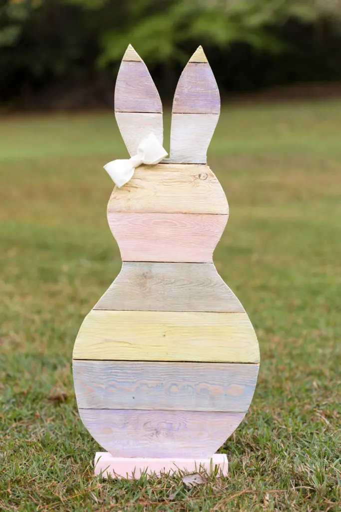Standing wood bunny painted in pastel paint stripes