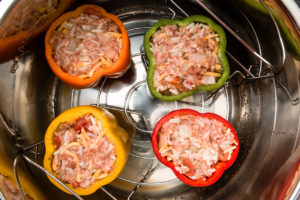 Place stuffed pepper with rice and meat into Instant Pot