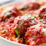 Marinara sauce on meatballs and spaghetti