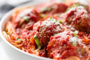 Marinara sauce on meatballs and spaghetti