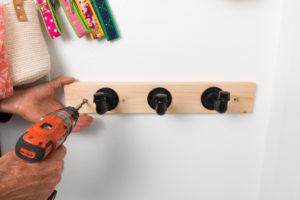 Use a level to Install the industrial pipe coat hooks Use a level to Install the industrial pipe coat hooks