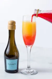Adding a little Grenadine to my mimosa