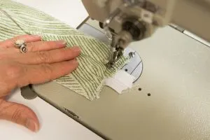 Sewing the ends of the zipper closed