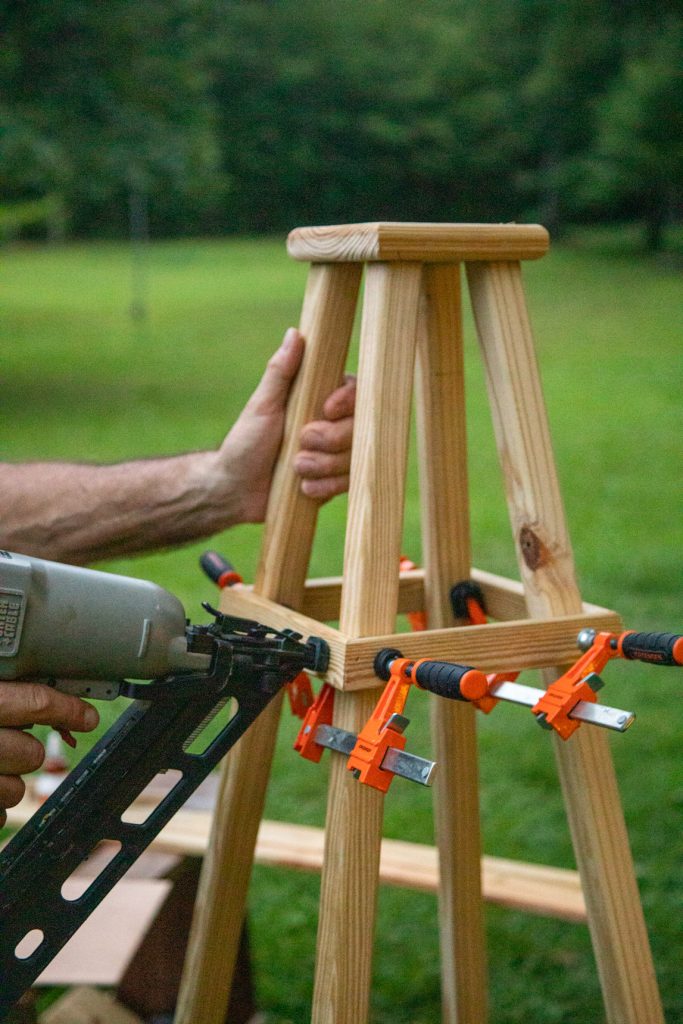 Using clamps to hold the rungs in place to nail