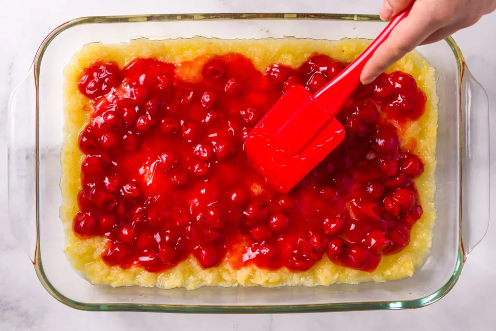 Spread cherries evenly over pineapple