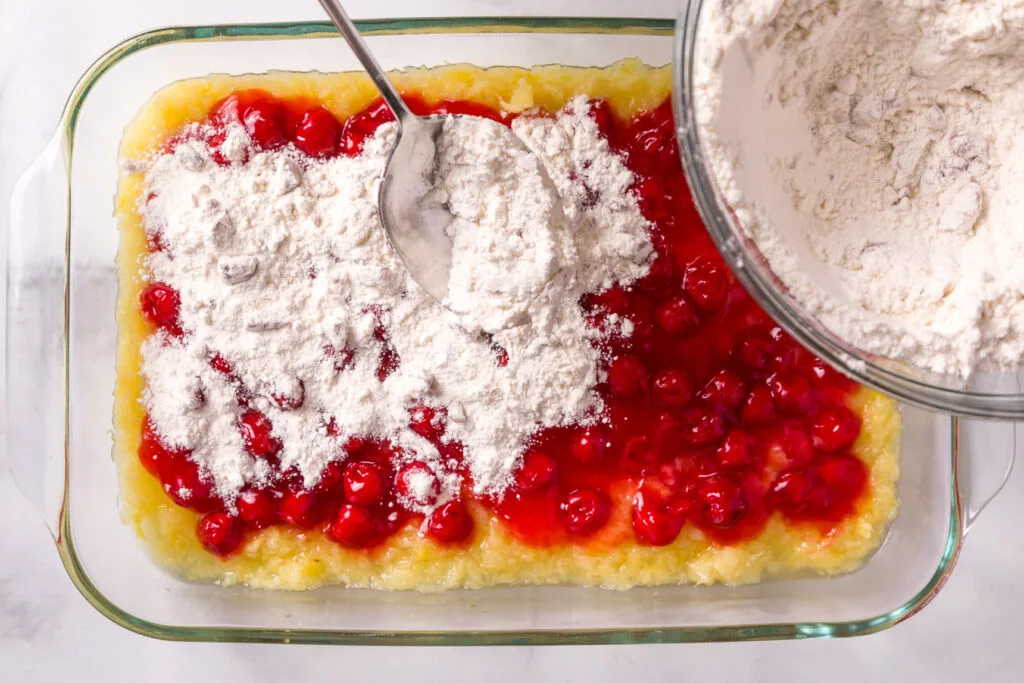 Sprinkle the cake mix mixture over fruit