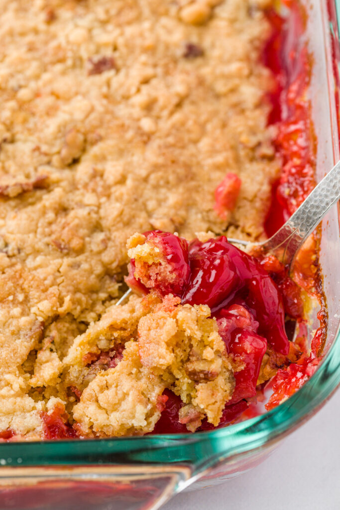 The cake is ready when the cherry filling is bubbly and golden brown