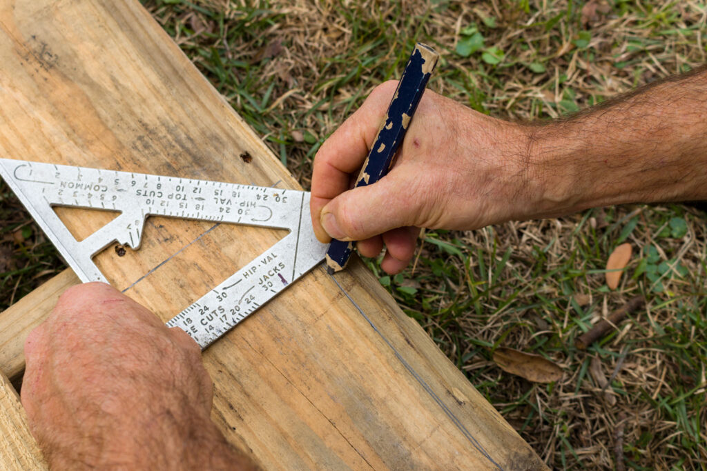 Marking the cutting line for the width of the boards