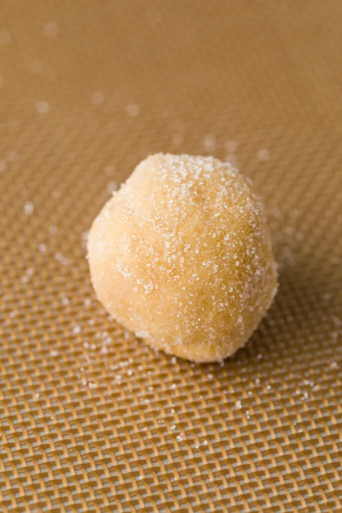 Place sugar coated peanut butter balls on a baking sheet 