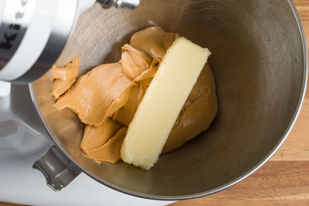 Add butter to peanut butter in the mixer