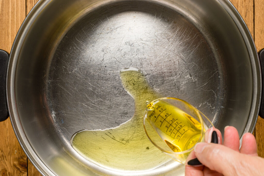 Adding oil to medium hot pan