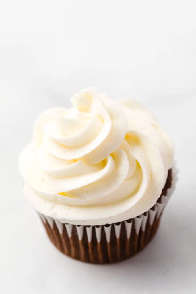 Buttercream frosting on a chocolate cupcake Buttercream frosting on a chocolate cupcake