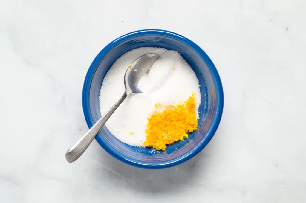Add orange zest to sugar