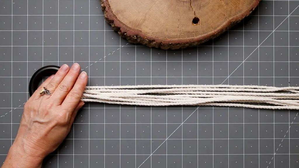 Place the macrame cord through the ring 