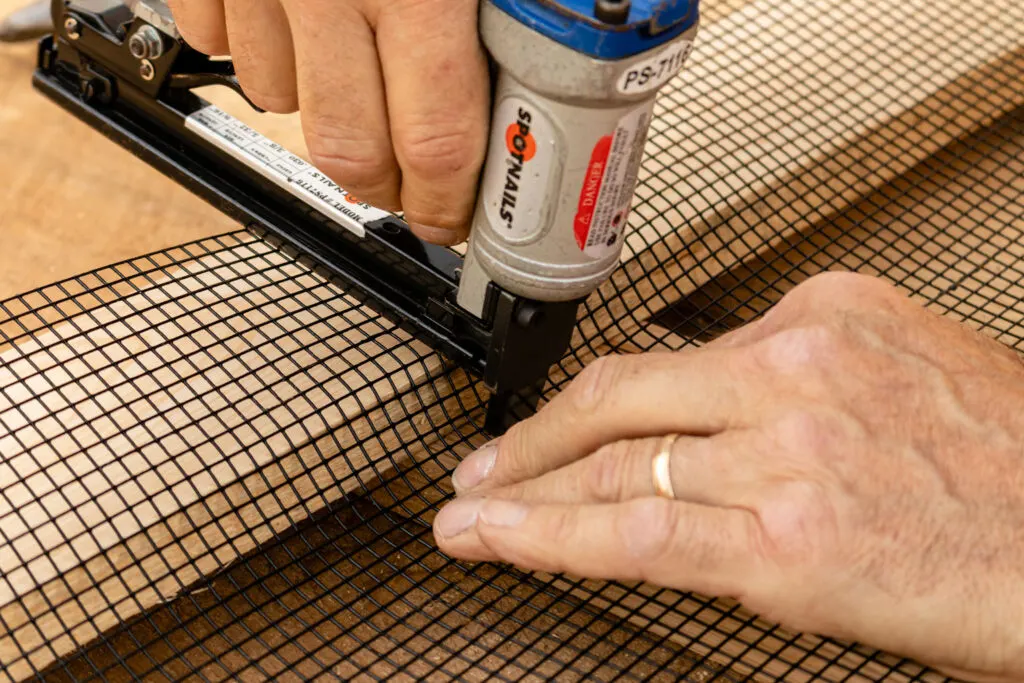 Form the hardware cloth to fit tightly against the wood