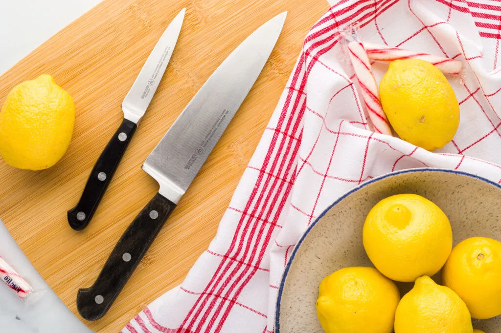 Gather a cutting board and lemons