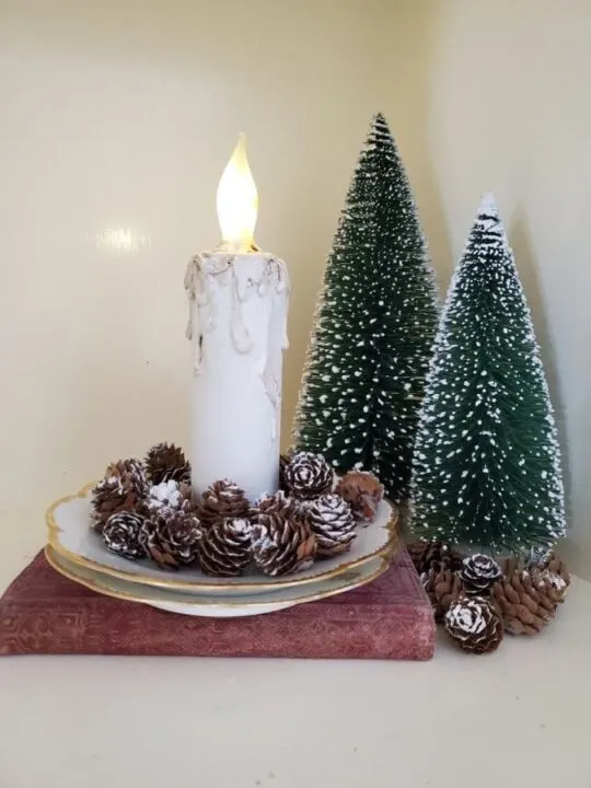 Handmade faux candle and bottle brush trees on a table