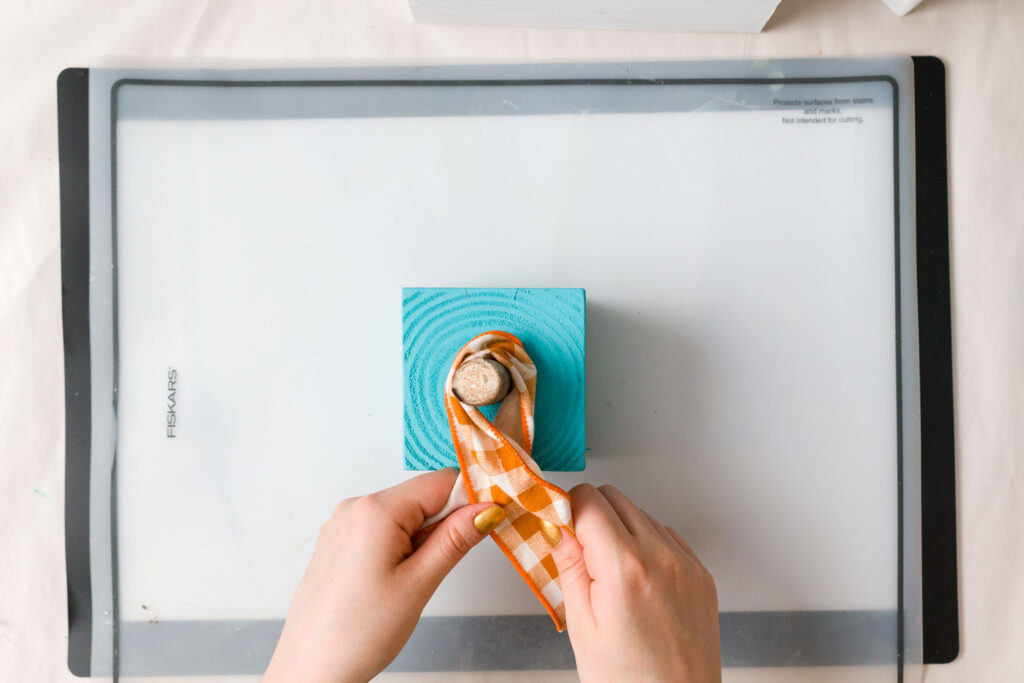 adding a ribbon to the Turquoise pumpkin 