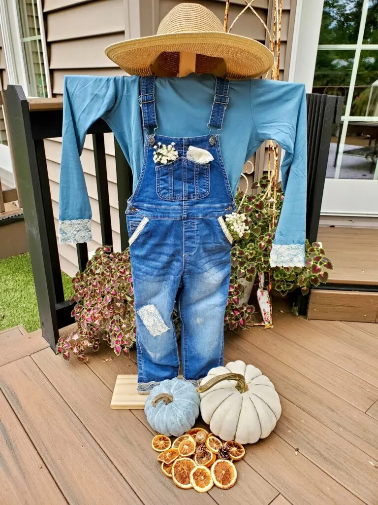 Blue jean overalls scarecrow on a porch 