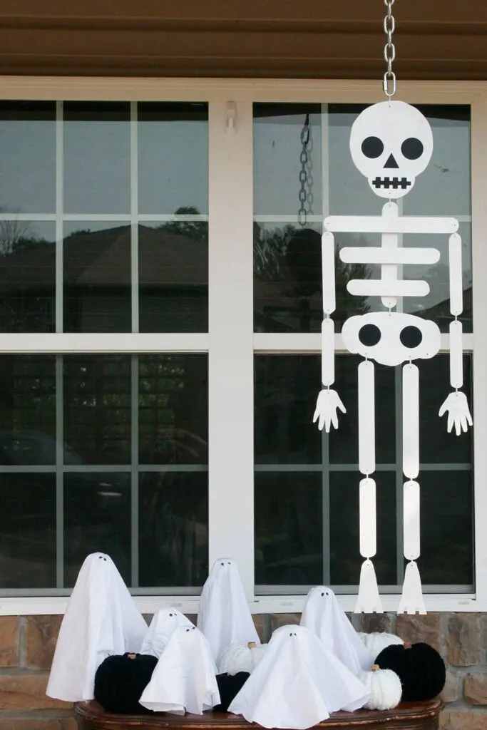 Handmade skeleton hanging from the porch roof