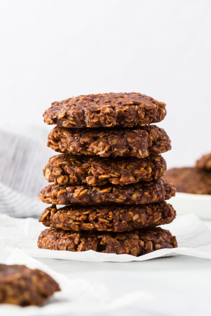 Chocolate no bake cookies stacked on a table 