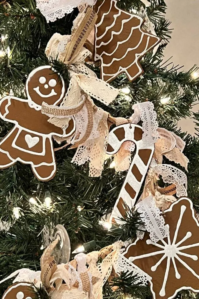 Gingerbread garland made with wooden cutouts and ribbons hanging 