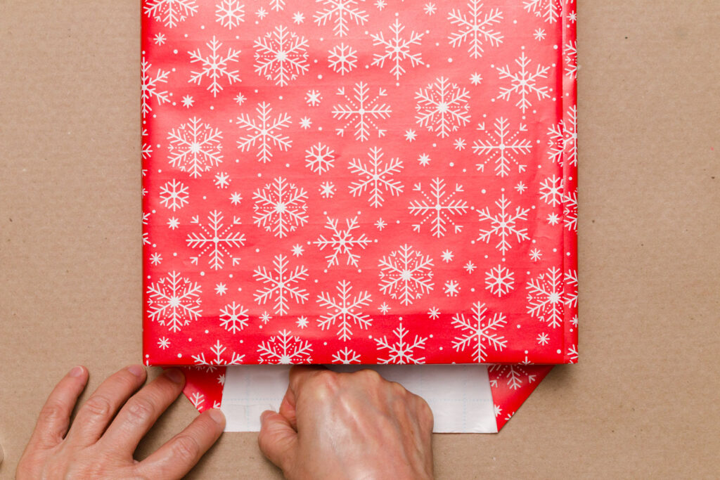 To finish the end of the box place double-side gift wrap on the inside of the top paper flap 