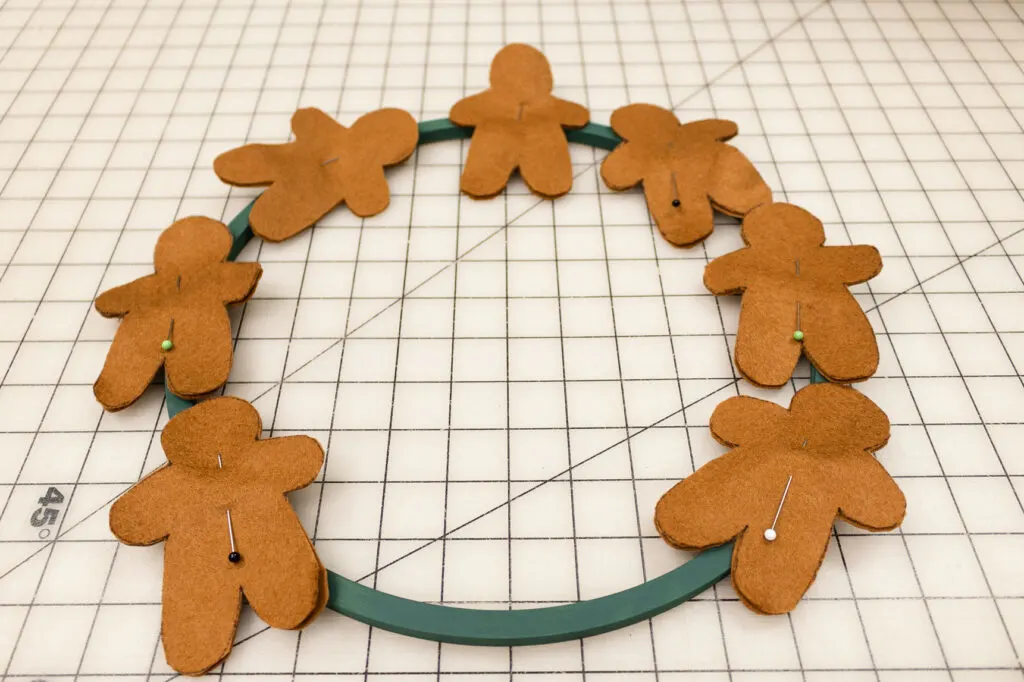 Wreath form with gingerbread felt pieces design layout