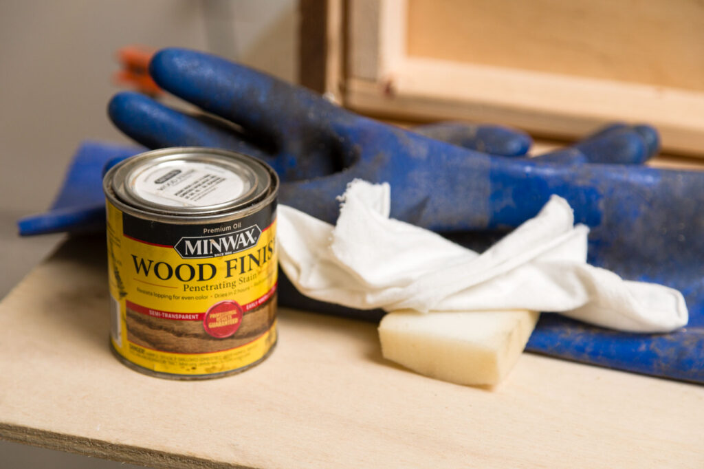 Wood staining supplies (stain, foam, gloves, and cotton cloth)