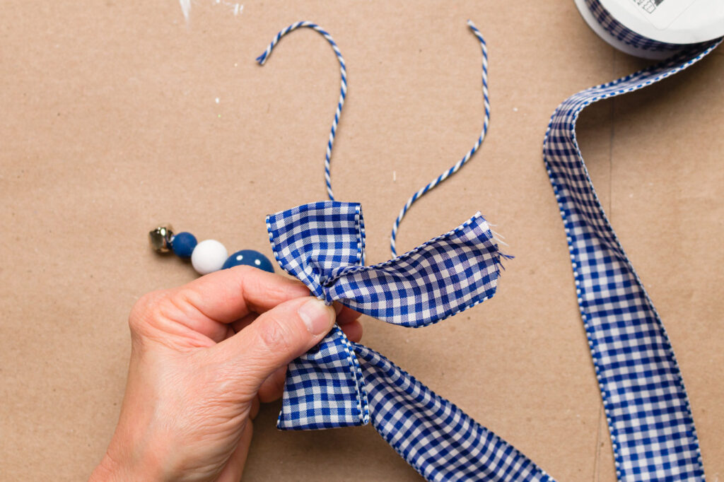 Making a simple loop bow with blue and white check ribbon