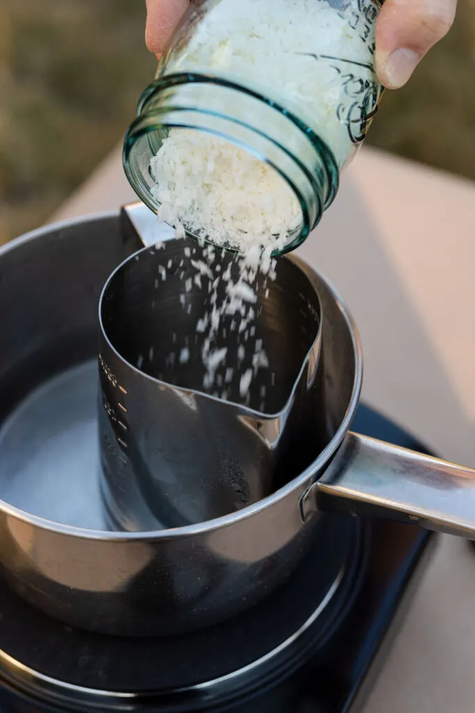 Add wax to the melting pot in a double boiler
