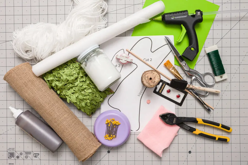 Crafting supplies on a craft mat on a table
