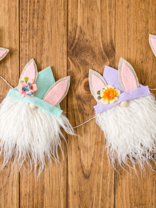 four Easter gnomes on baker's twine to make a garland