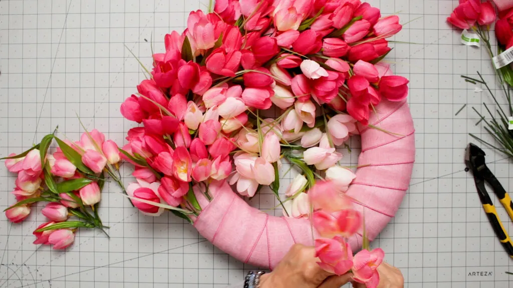 Cut tulips in stacks by color intensity