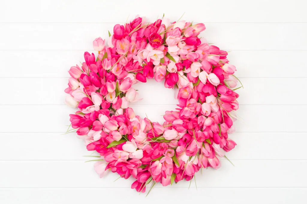 Tulip Wreath Pink tulip wreath hanging on a white wall