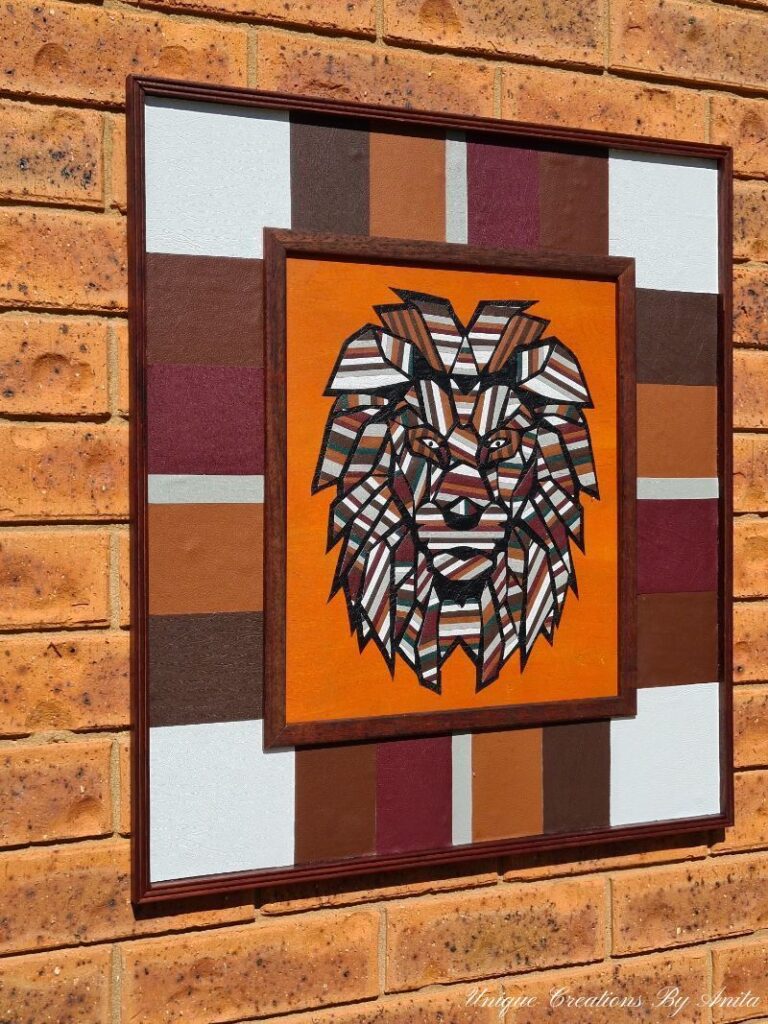 Wall art with a lion and geometric shapes in the brown, orange and white